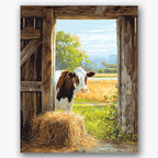 Paint by numbers design of cow, barn, cow in doorway, hay bale foreground, A cow stands in the barn doorway