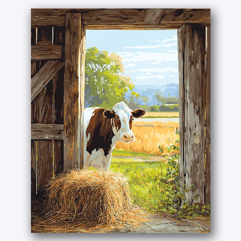 Paint by numbers design of cow, barn, cow in doorway, hay bale foreground, A cow stands in the barn doorway