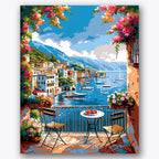 Paint by numbers design of coastal village, flowering balcony, vibrant flowers, rolling mountains
