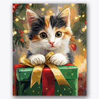 Paint by numbers design of kitten, gift box, cute calico kitten, golden ribbon bow, A charming kitten rests atop a gift box